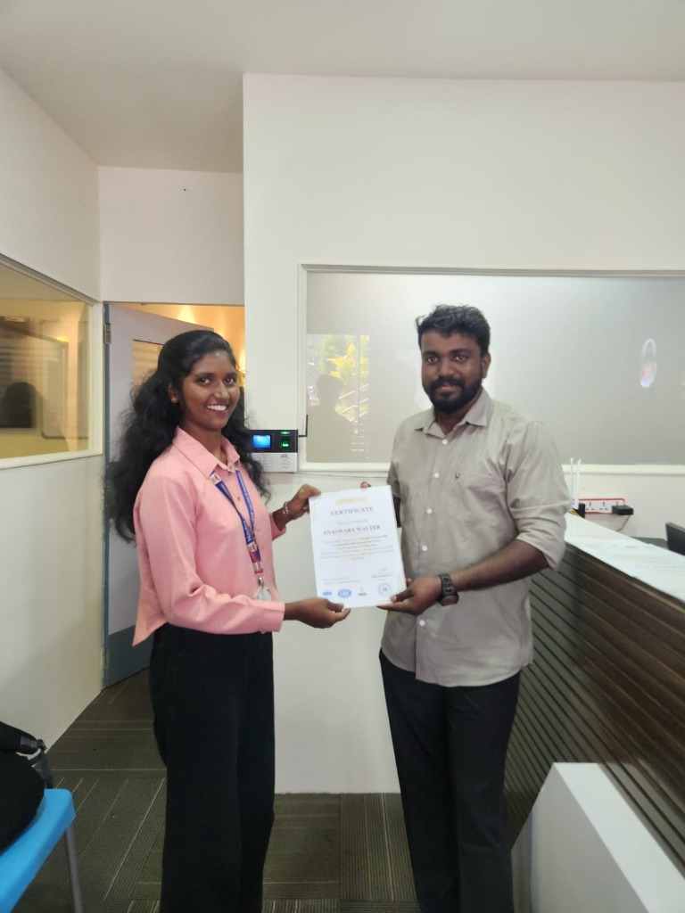 Anaswara receiving certificate at GreatSkill