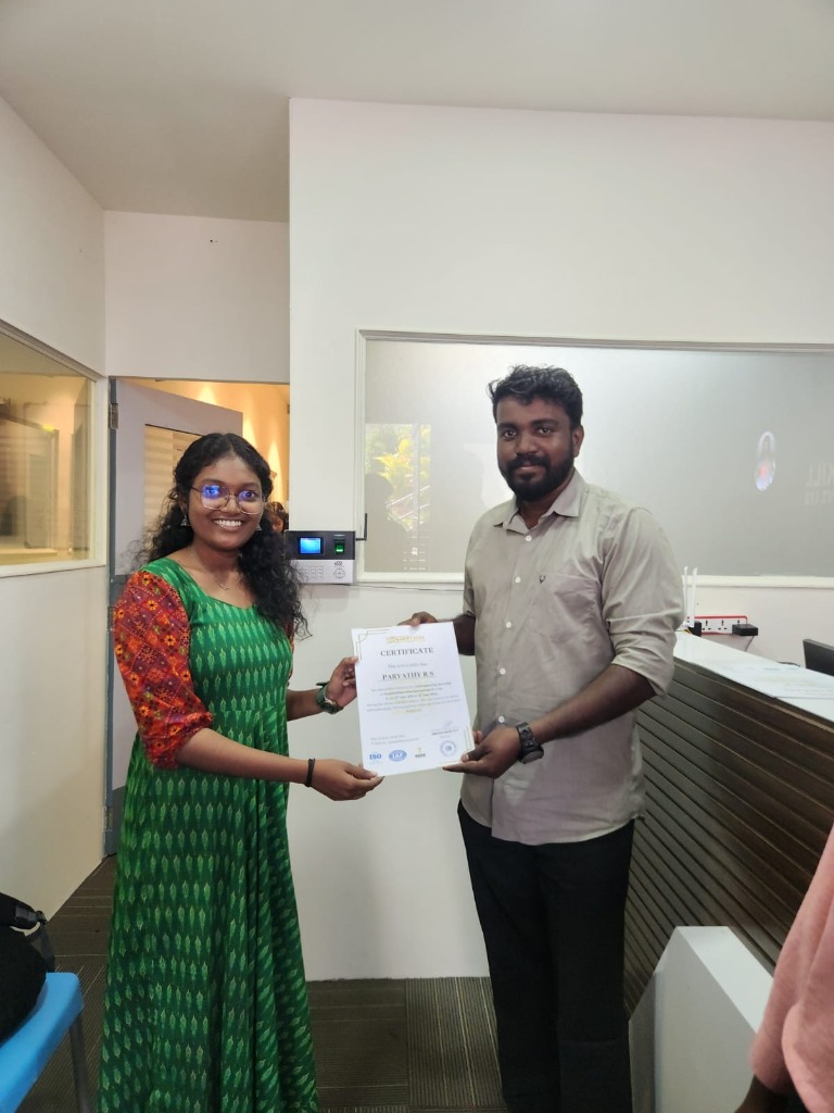 Parvathy R S receiving certificate at GreatSkill