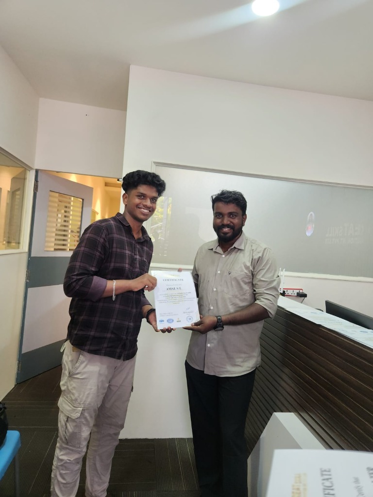Amal S L receiving certificate at GreatSkill