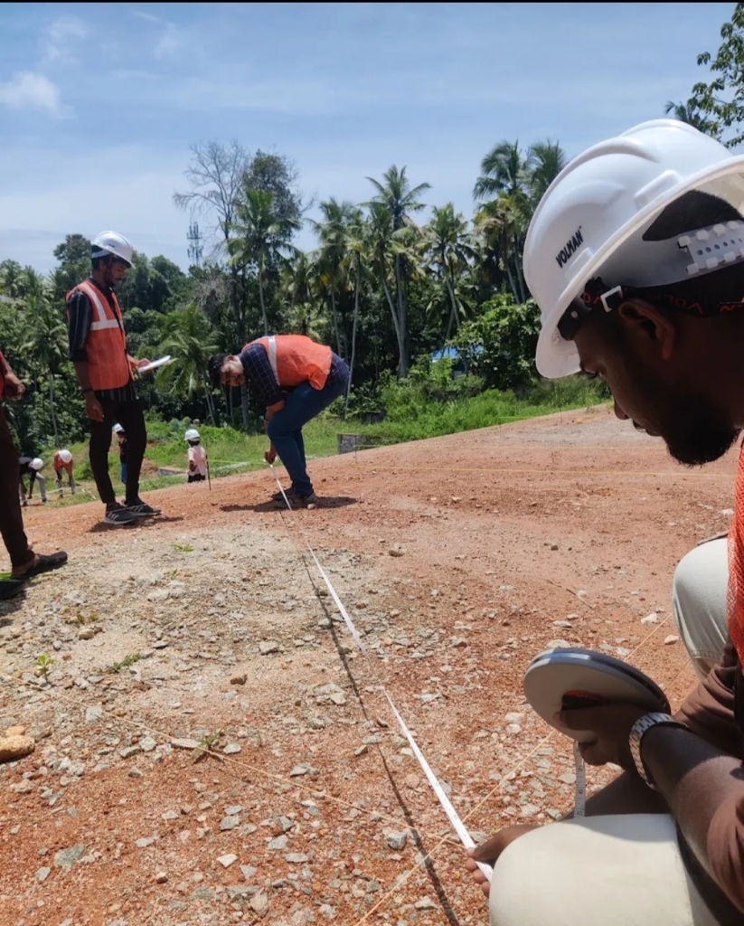 Student learning how to use measuring tape on site