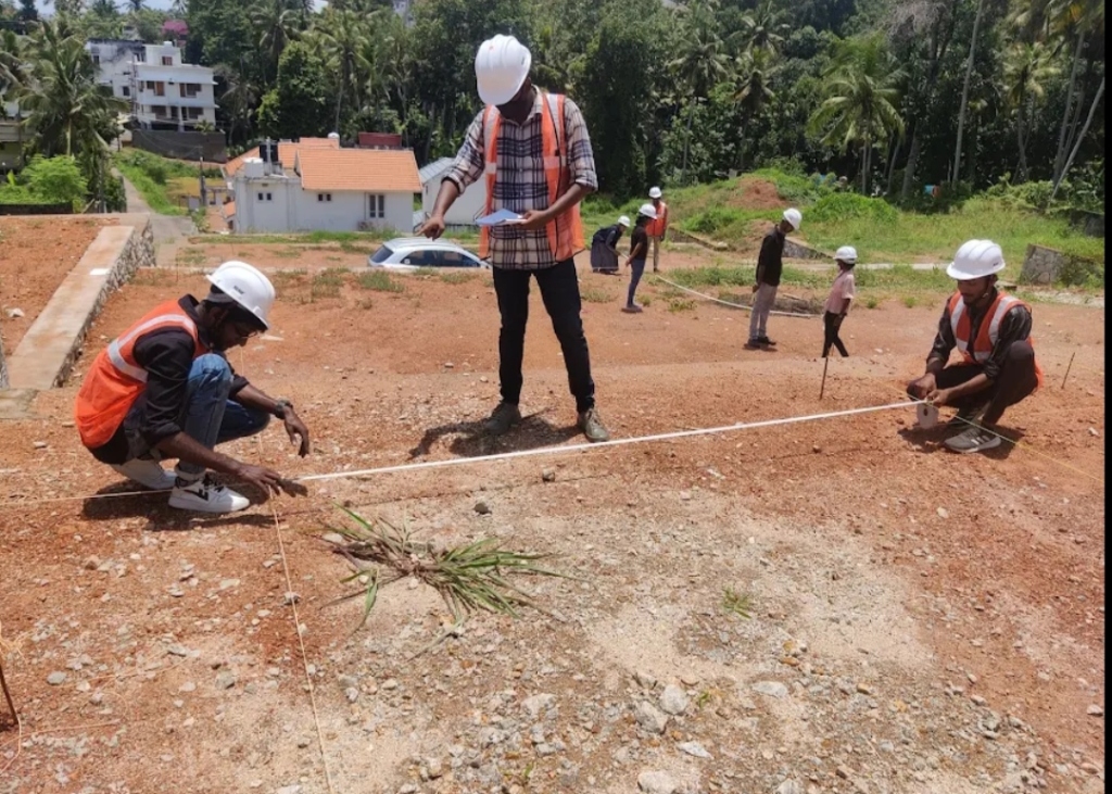 Students measuring distances using tape during civil engineering training