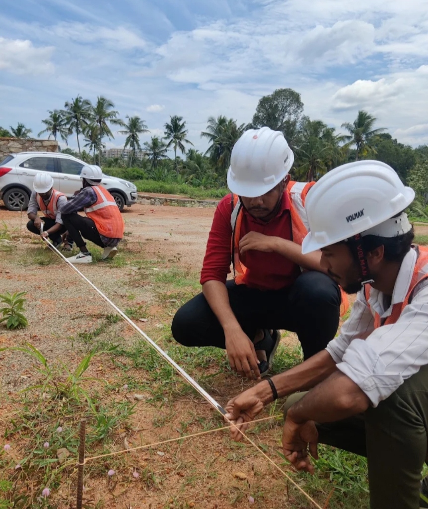 Students practicing tape measurement at site layout