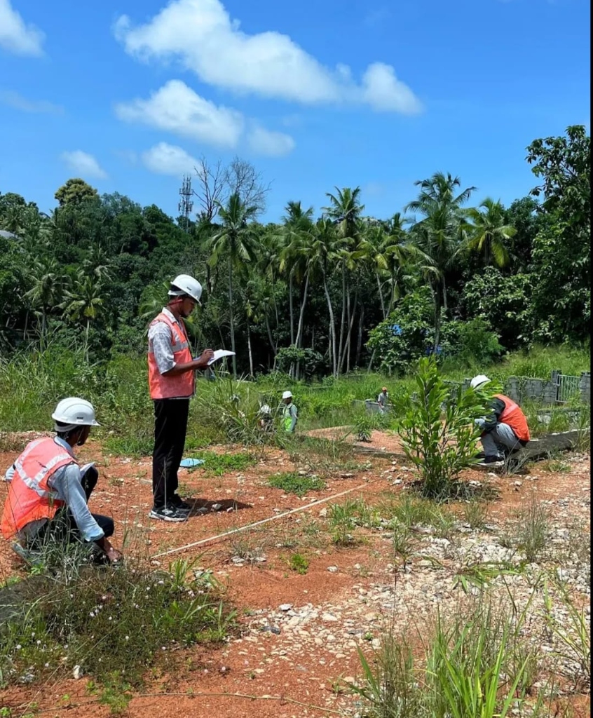 Civil engineering students recording data during onsite field training