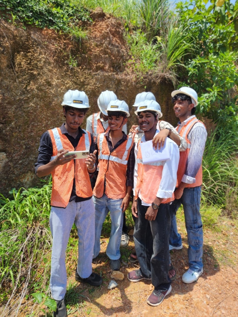 Civil engineering student group posing at excavation site